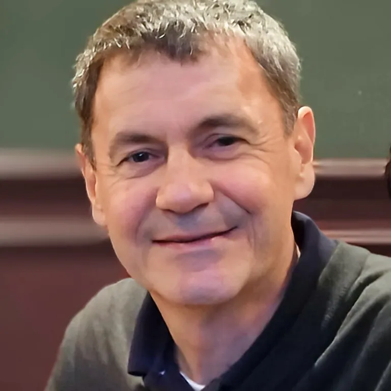 Close up front facing profile picture of a man
